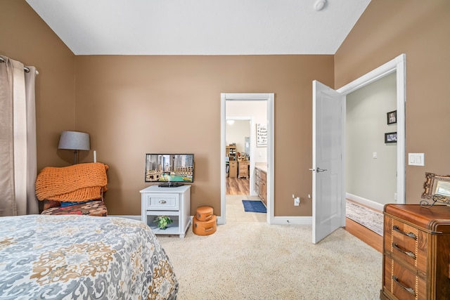 carpeted bedroom with vaulted ceiling