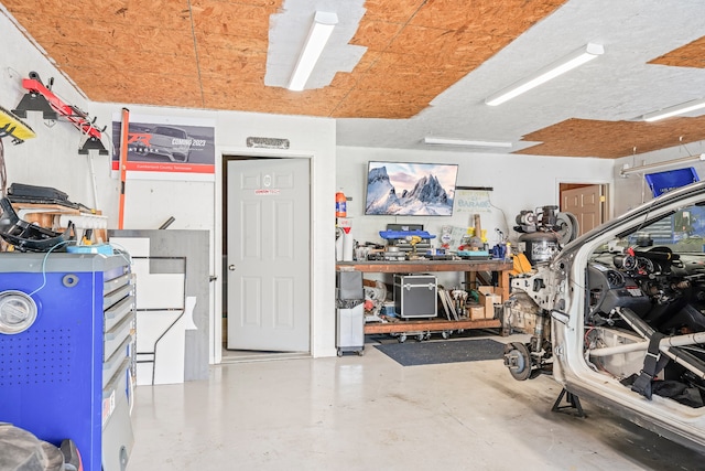 interior space with concrete floors and a workshop area