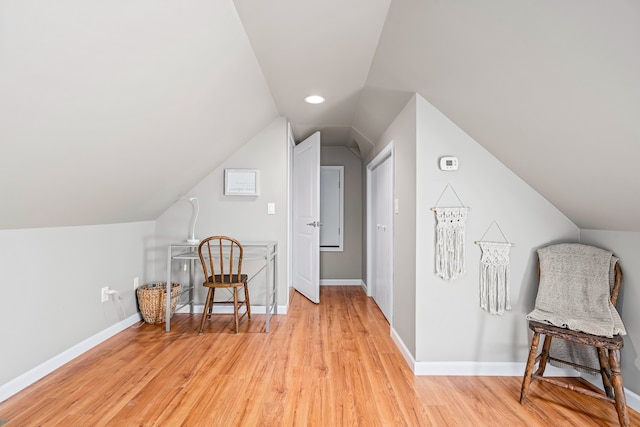 bonus room featuring light hardwood / wood-style flooring and vaulted ceiling