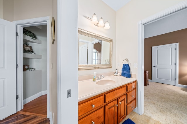 bathroom with tile flooring and vanity