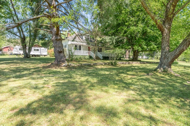 view of yard featuring a porch