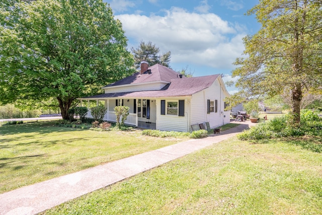 view of front of house with a front lawn and a porch