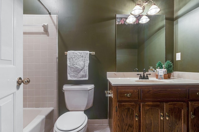 full bath featuring shower / bath combination, toilet, vanity, tile patterned flooring, and baseboards