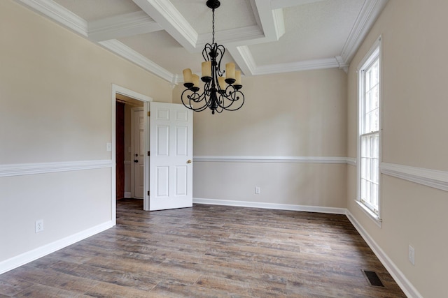 unfurnished dining area with dark hardwood / wood-style flooring, an inviting chandelier, ornamental molding, coffered ceiling, and beamed ceiling