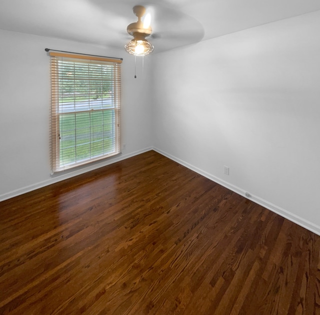 unfurnished room featuring dark hardwood / wood-style floors and ceiling fan