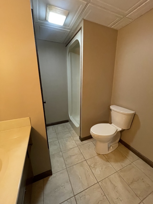 bathroom featuring a shower, vanity, and toilet