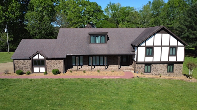 rear view of house with a yard