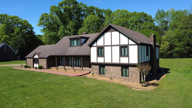 back of house featuring a yard