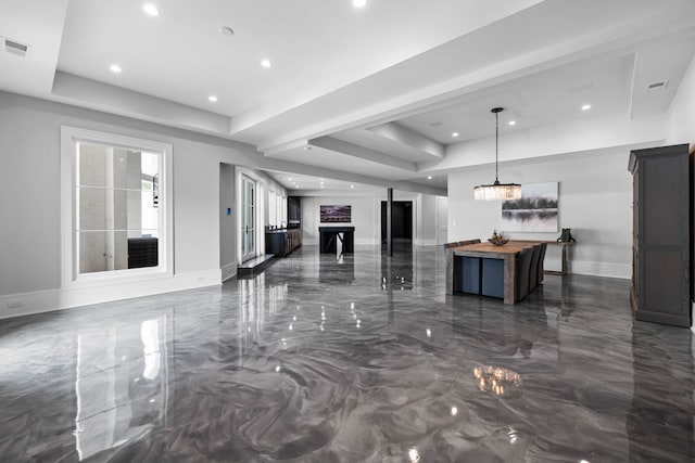 living room featuring a tray ceiling