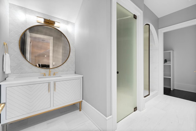 bathroom featuring an enclosed shower, vanity, and tile floors