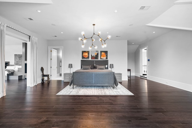 living room featuring a chandelier and dark wood-type flooring