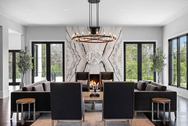 interior space featuring plenty of natural light, a chandelier, french doors, and dark hardwood / wood-style floors