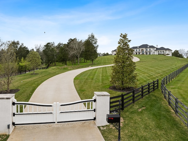 surrounding community with a yard and a rural view