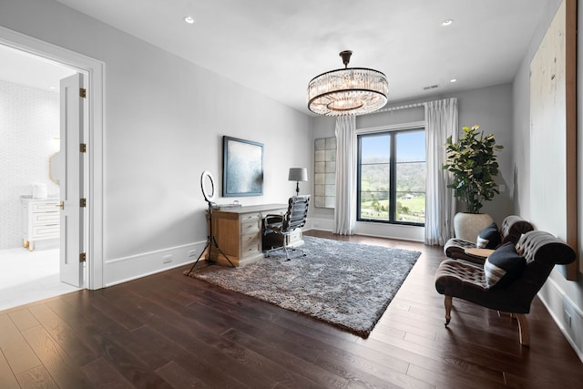 office area featuring an inviting chandelier and wood-type flooring