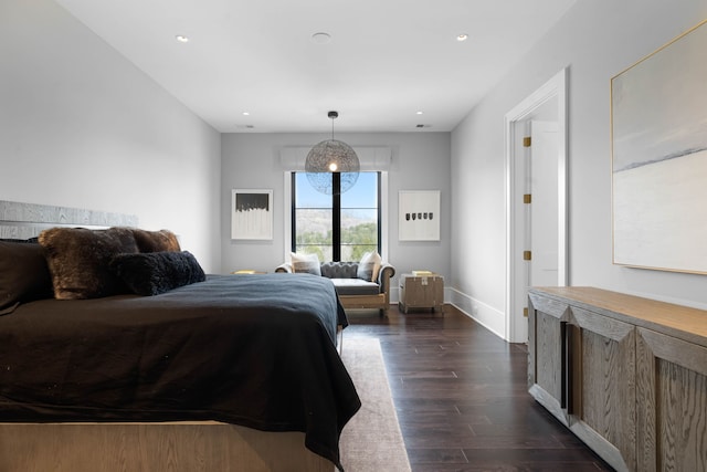 bedroom with dark wood-type flooring