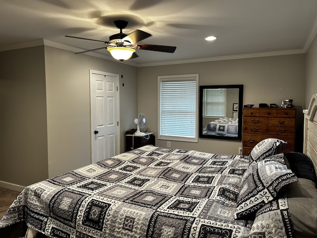 bedroom with ornamental molding, ceiling fan, and baseboards