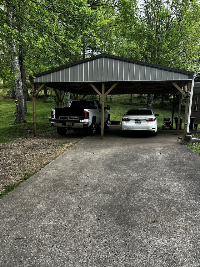 view of vehicle parking with a carport and driveway