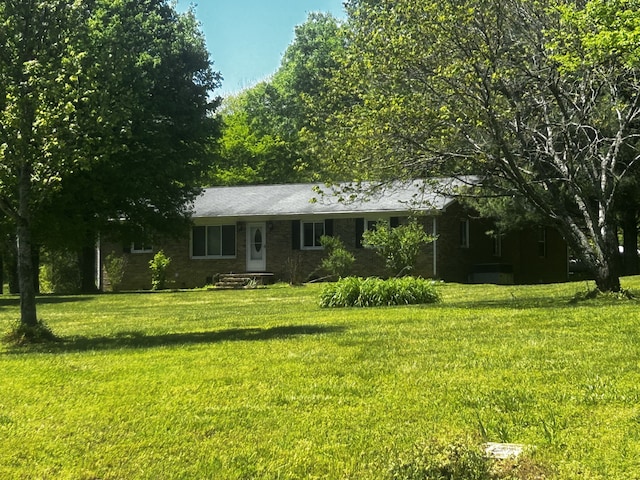 ranch-style house with a front lawn