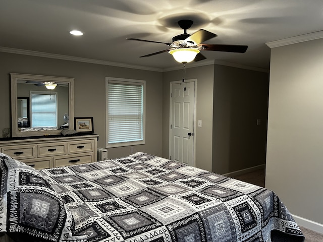 bedroom with ceiling fan, baseboards, and ornamental molding