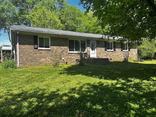 single story home with crawl space, brick siding, and a front lawn