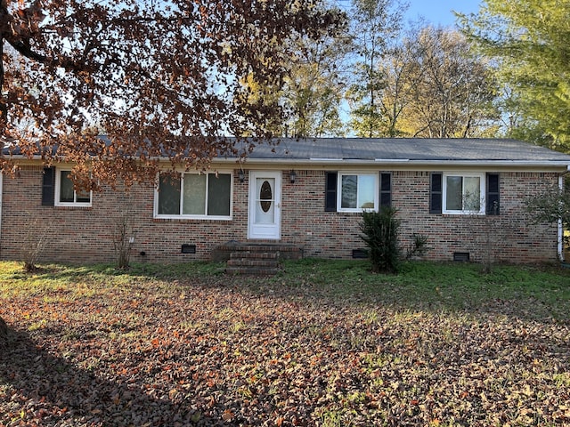 ranch-style house featuring entry steps, brick siding, crawl space, and a shingled roof