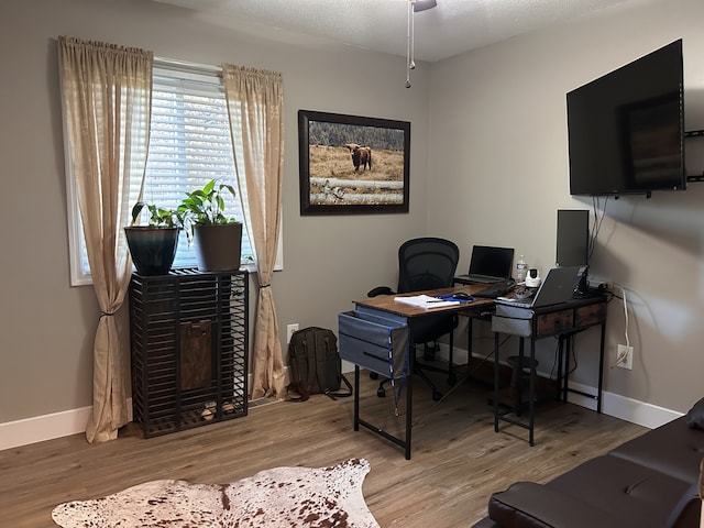 office featuring wood finished floors and baseboards