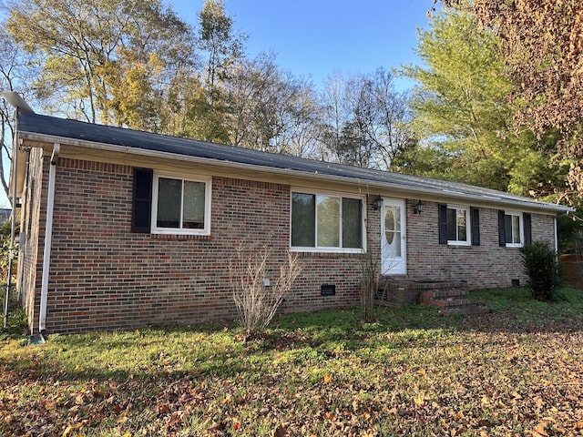 single story home featuring crawl space and brick siding