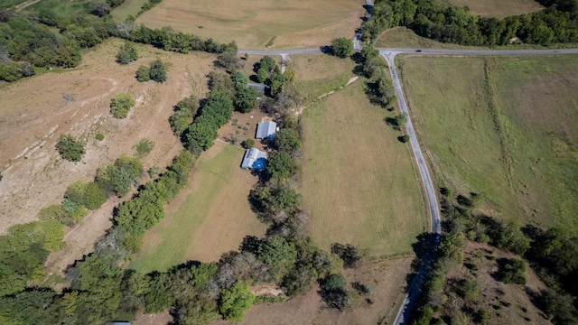 birds eye view of property featuring a rural view