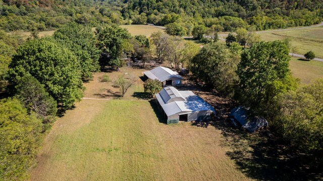 birds eye view of property with a wooded view