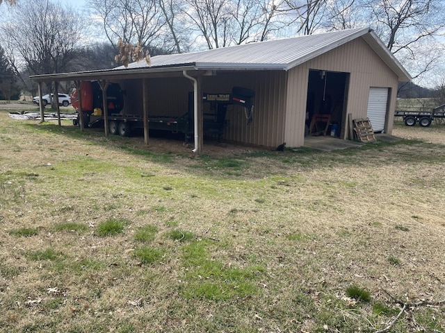 view of pole building with a yard