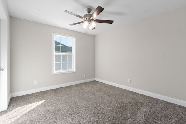 carpeted empty room featuring ceiling fan