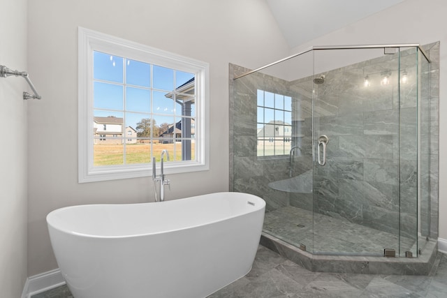 bathroom with shower with separate bathtub and tile floors