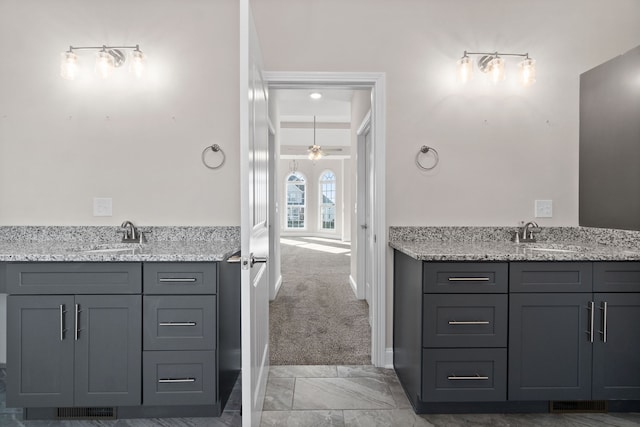 bathroom with tile flooring and vanity