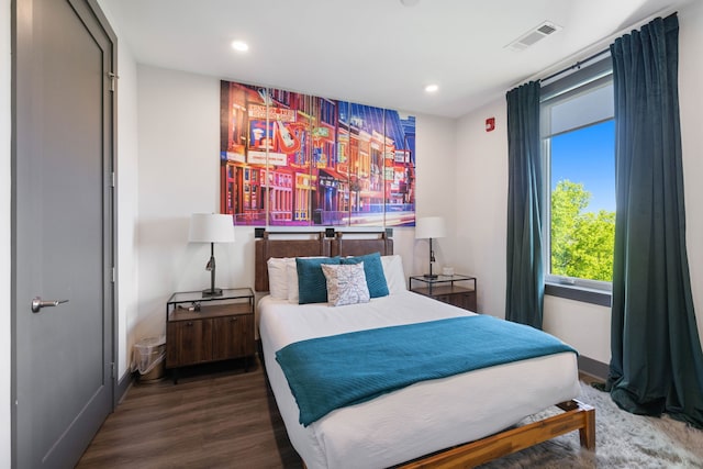 bedroom featuring dark hardwood / wood-style floors