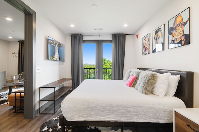 bedroom featuring french doors, dark wood-type flooring, and access to exterior