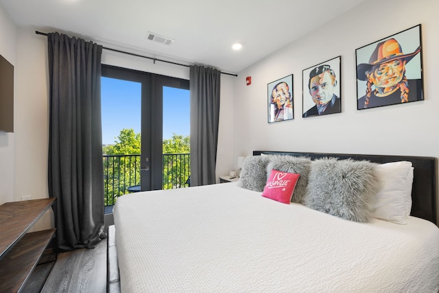 bedroom featuring wood-type flooring, french doors, and access to exterior