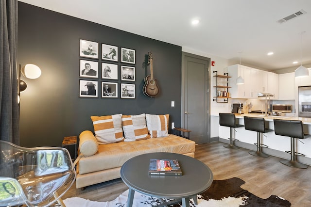 living room with light hardwood / wood-style floors