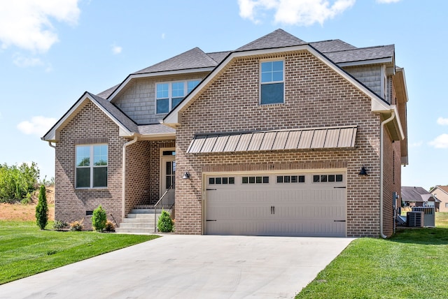 craftsman-style house with central AC, a garage, and a front yard