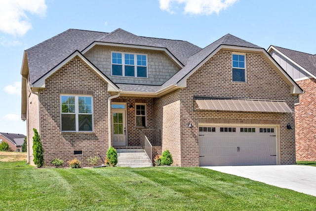 craftsman house featuring a garage and a front yard