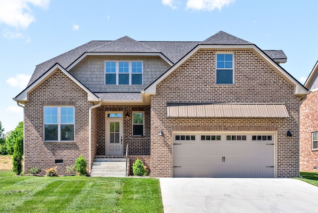 view of front of home featuring a garage and a front yard