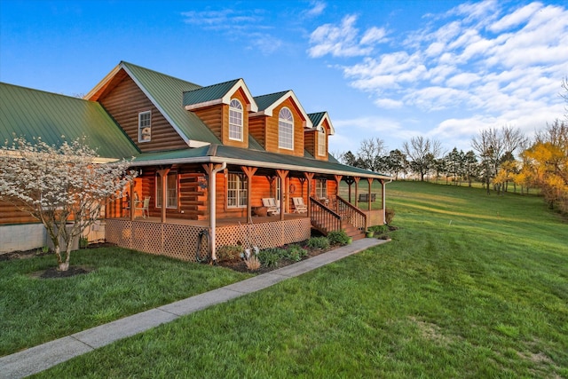 exterior space with a porch and a lawn