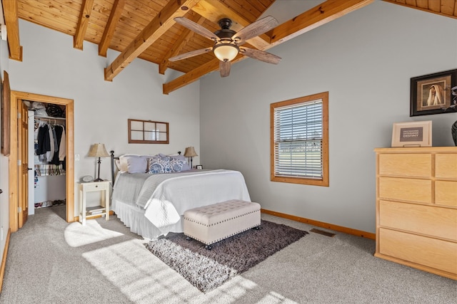 carpeted bedroom with a closet, ceiling fan, and wooden ceiling