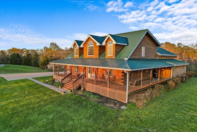 view of front of house featuring a front lawn and covered porch