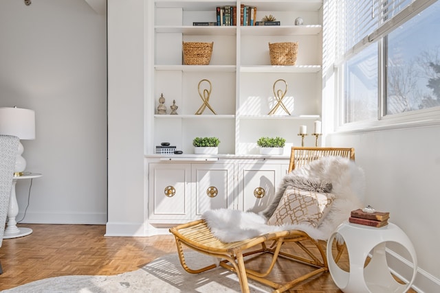 living area featuring light parquet flooring