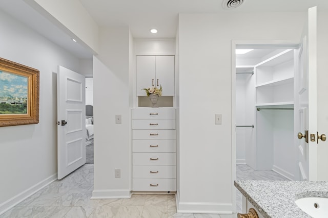 spacious closet featuring light tile floors