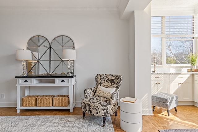 sitting room featuring parquet floors and crown molding