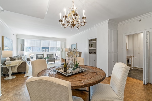 dining space with light parquet flooring, crown molding, and a chandelier