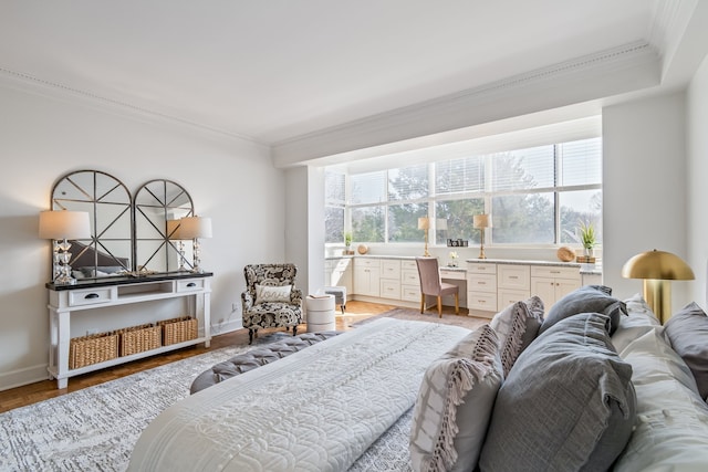 bedroom with light hardwood / wood-style floors and ornamental molding