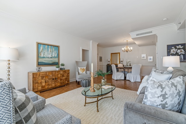 living room with parquet flooring, a notable chandelier, and crown molding