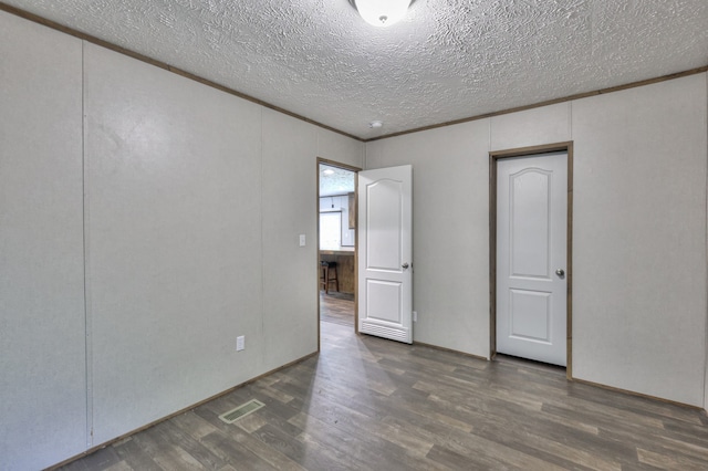 5077 Southpoint Ridge Rd, Hampshire, TN 38461 - empty room featuring a textured ceiling and dark wood-type flooring
